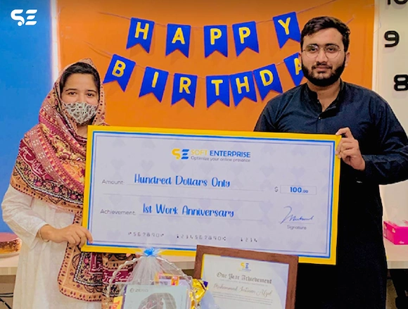 Team members celebrating achievements with certificates at Soft Enterprise on 22 November 2024.