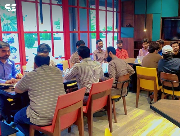 Team enjoying pizza together at Soft Enterprise Fun Pizza Day event on 16 June 2024.