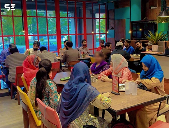 Team enjoying a meal together during Soft Enterprise Fun Pizza Day event on 16 June 2024.