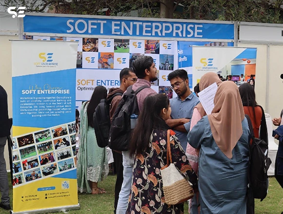 Soft Enterprise booth at UOL Career Fair 2025, with attendees engaging.