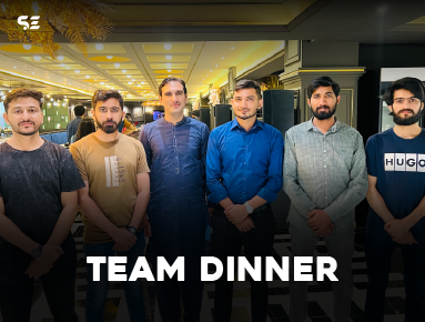 Team enjoying a buffet dinner together during Team Dinner event.