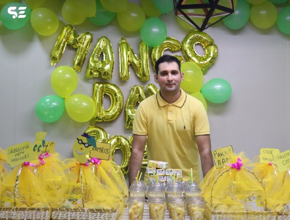 Colleague having fun during Mango Day at office.