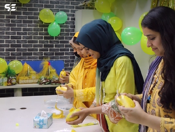 Colleagues enjoying fun games during Mango Day at office.