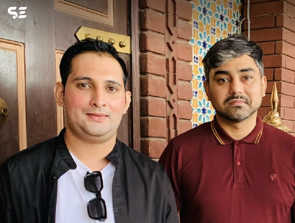 Soft Enterprise CEO with an employee during farewell lunch.