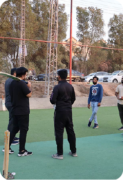 Employees participating in cricket game