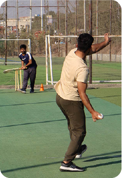 Soft Enterprise team member playing cricket during sports day