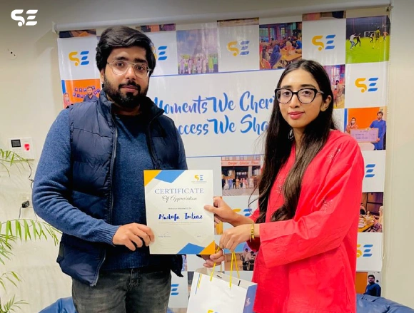 Soft Enterprise employee being recognized for outstanding performance at the awards ceremony.