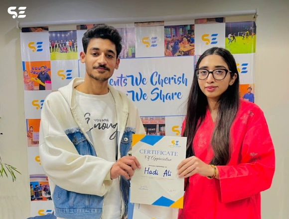 Soft Enterprise employee being recognized for outstanding performance at the awards ceremony.