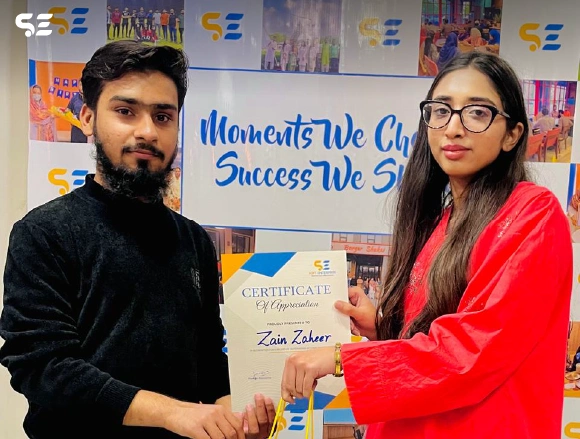 Soft Enterprise employee being recognized for outstanding performance at the awards ceremony.