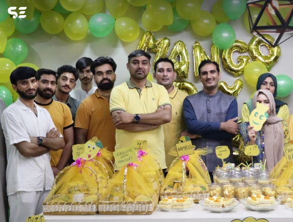 Team gathering for Mango Day celebration at Soft Enterprise.