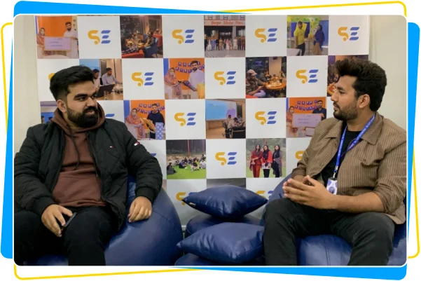 Business partners discussing growth strategies during a meeting at Soft Enterprise