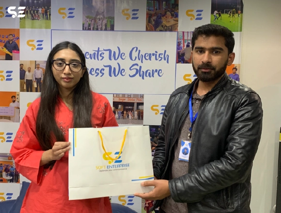 Soft Enterprise employee receiving a winner award at the Game Event.