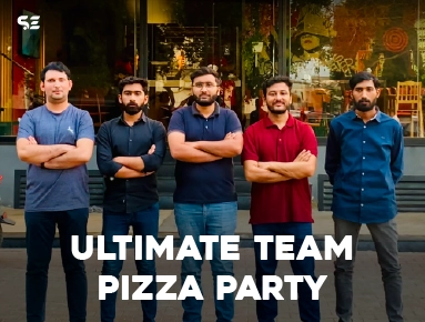 Group of male colleagues posing together at Ultimate Team Pizza Party