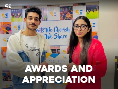 Male and female employee posing together for Awards and Appreciation event