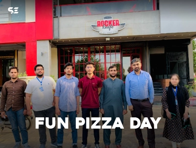 Soft Enterprise team group photo outside a pizza restaurant for Fun Pizza Day