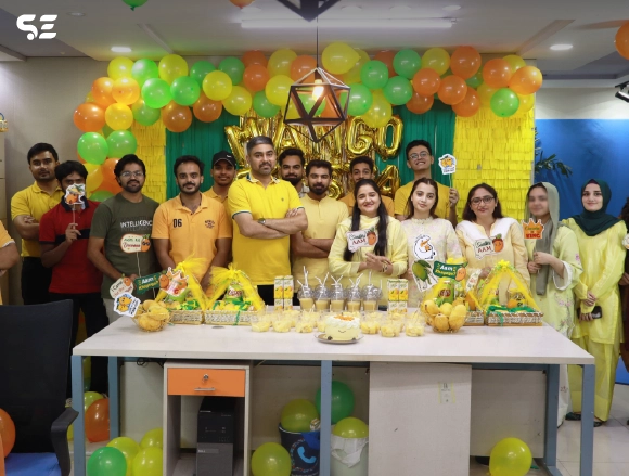Group of employees posing together at Mango Fiesta event