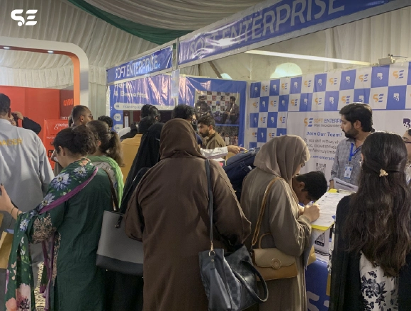 Group of colleagues gathered near an exhibition booth