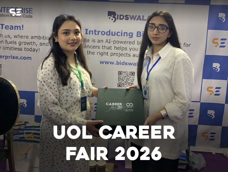 Female employee posing near Bidswala booth at UOL Career Fair 2026